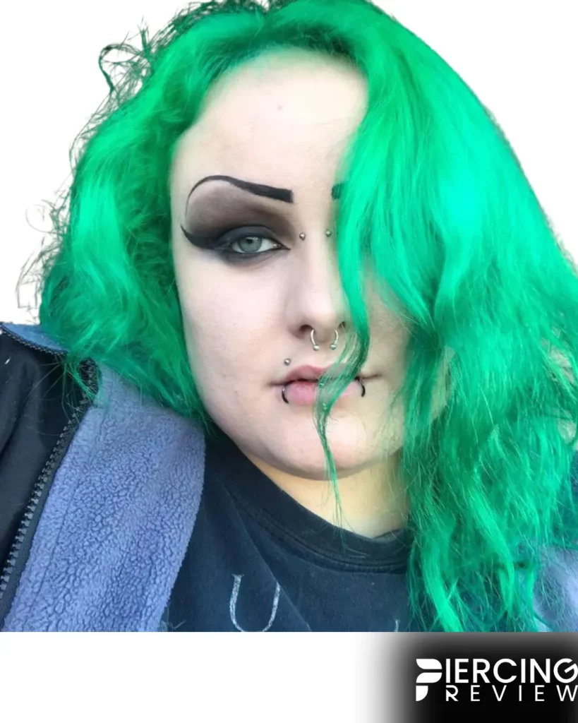 colord hair girl with below lip ring -Canine Bites Piercing Ideas