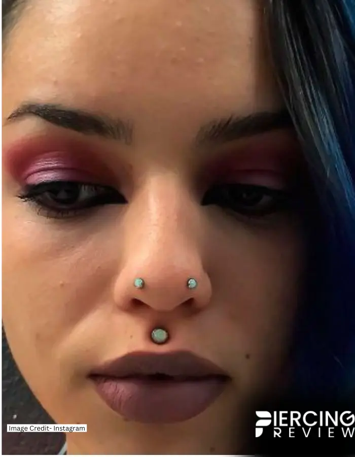 women image with light green stone studs on Austin Bar nose Piercing